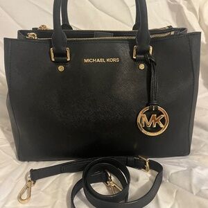 Michael Kors Medium Black Leather Bag. Barely used. Wear on shoulder / handles.